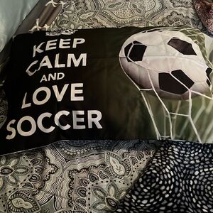 Satin, zippered soccer pillow case. Never used- non smoking home.